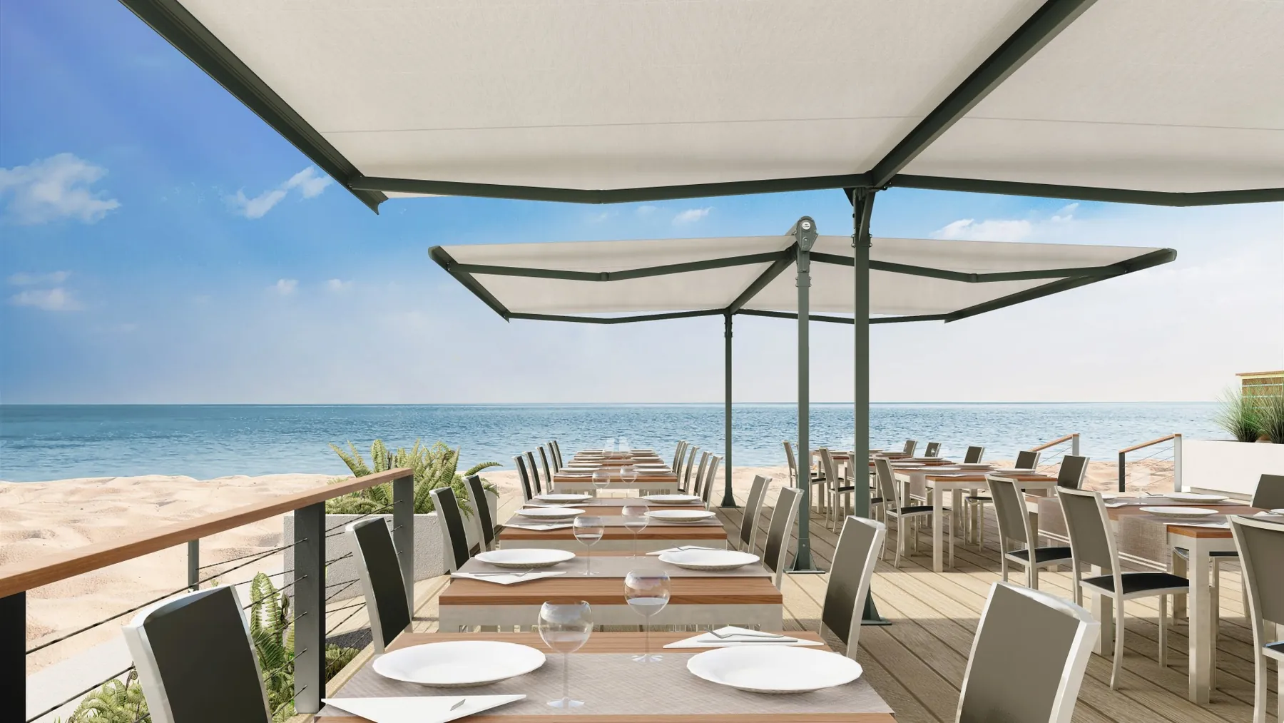 Toldo doble Duox sobre una terraza gastronómica frente al mar